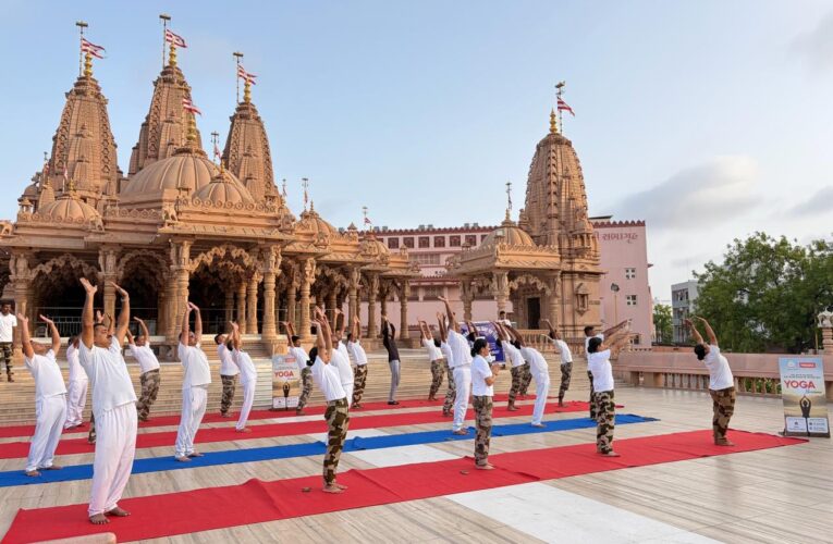 CISF personnel perform yoga at Rajkot Swaminarayan Temple ahead of International Yoga Day